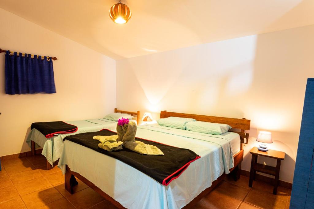 Кровать или кровати в номере Pochote Lodge