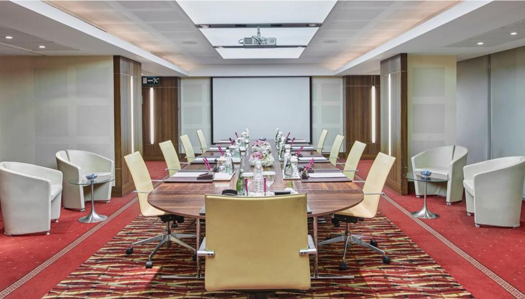 a large conference room with a long table and chairs at Holiday Inn Kuwait Al Thuraya City by IHG in Kuwait