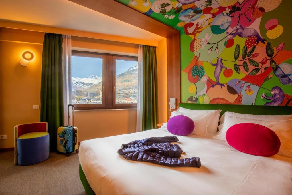 Postel nebo postele na pokoji v ubytování OMAMA Hotel