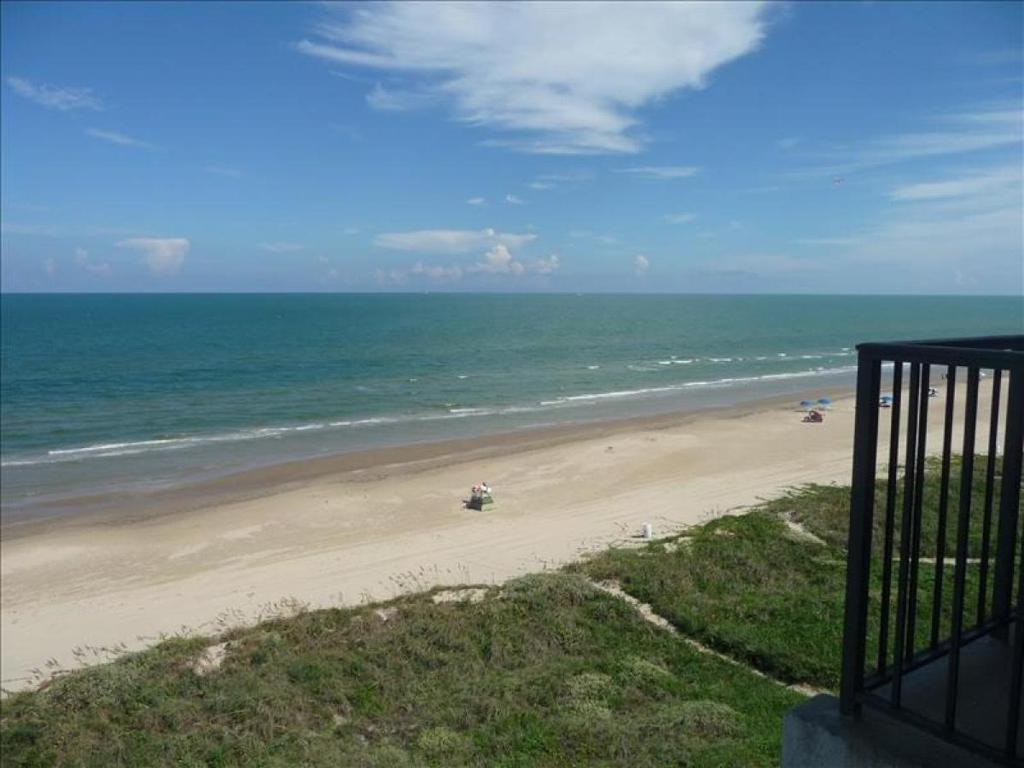 a view of a beach from a balcony at Florence I Condos F1705 in South Padre Island