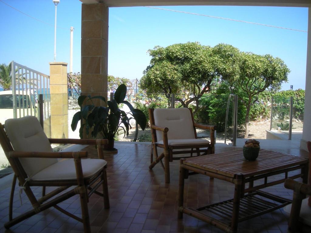 A balcony or terrace at Villa On The Beach Spiaggia Plaia