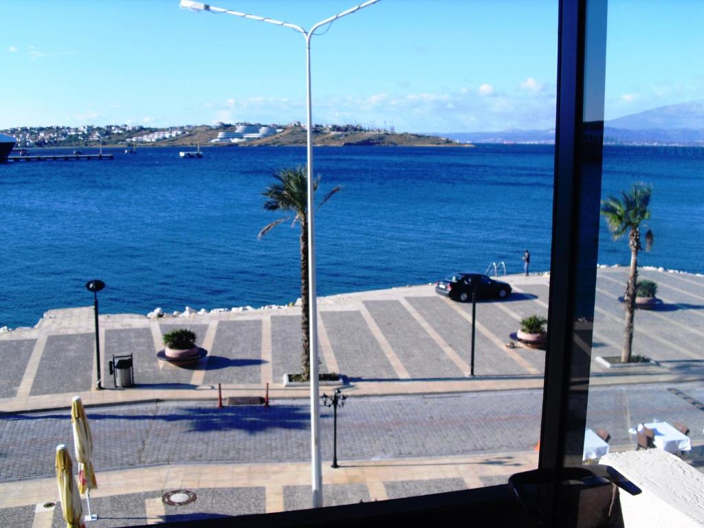 a view of the ocean from a window at Kerman Hotel in Cesme