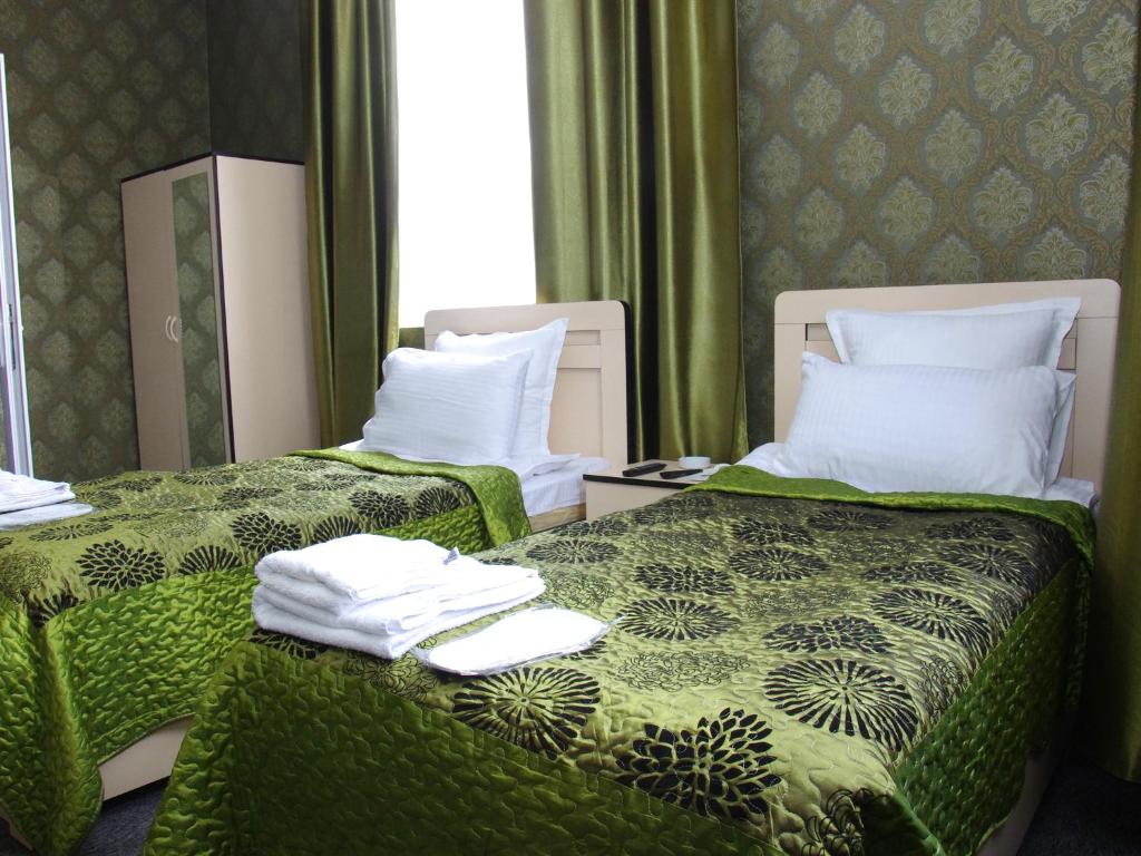 Postel nebo postele na pokoji v ubytování Hotel Shalimar