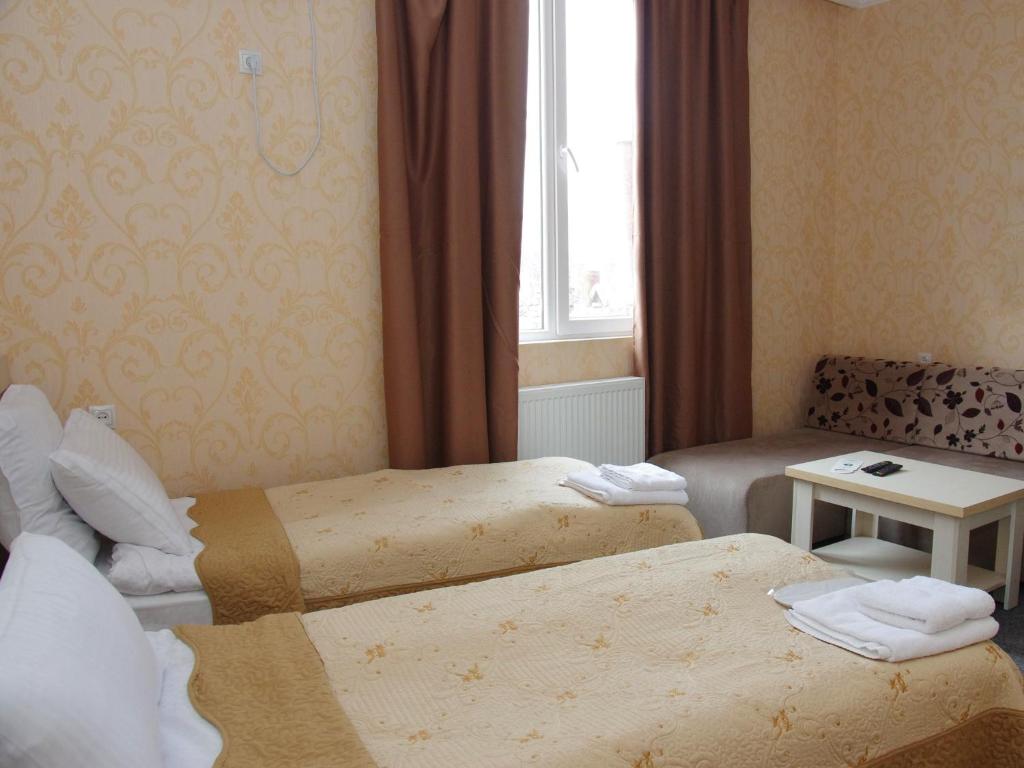 Postel nebo postele na pokoji v ubytování Hotel Shalimar