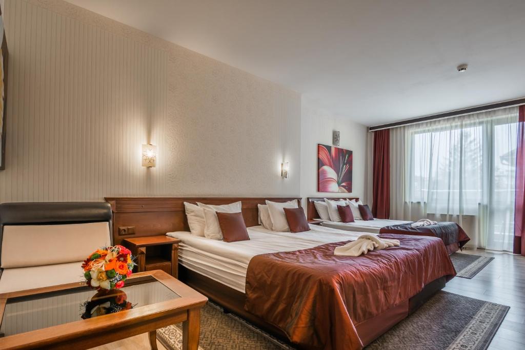 Кровать или кровати в номере Aris Hotel Sofia