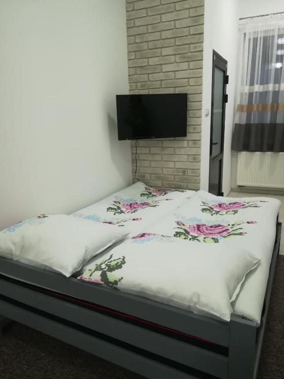 Posteľ alebo postele v izbe v ubytovaní Buko apartamenty