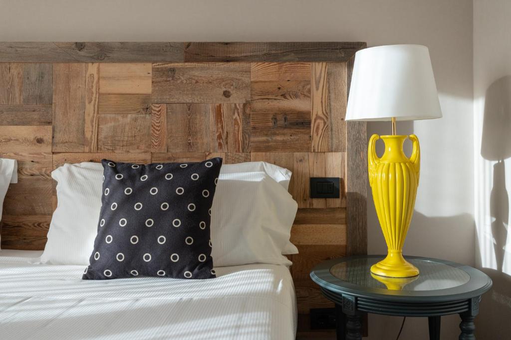Postel nebo postele na pokoji v ubytování Hotel Leon d'Oro
