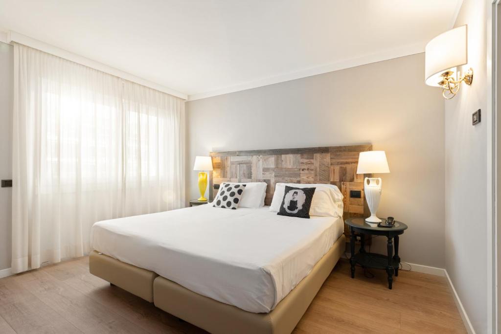 Postel nebo postele na pokoji v ubytování Hotel Leon d'Oro