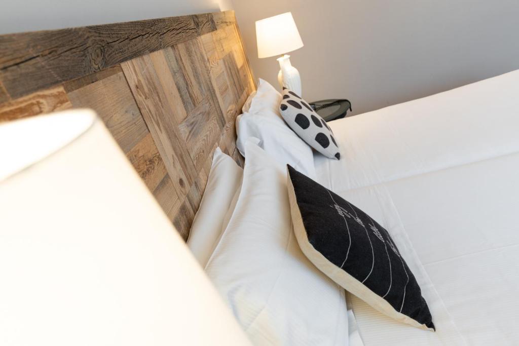 Postel nebo postele na pokoji v ubytování Hotel Leon d'Oro
