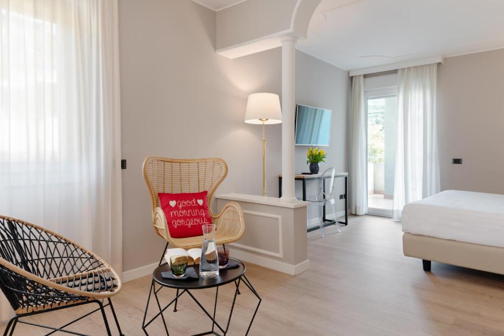 Postel nebo postele na pokoji v ubytování Hotel Leon d'Oro
