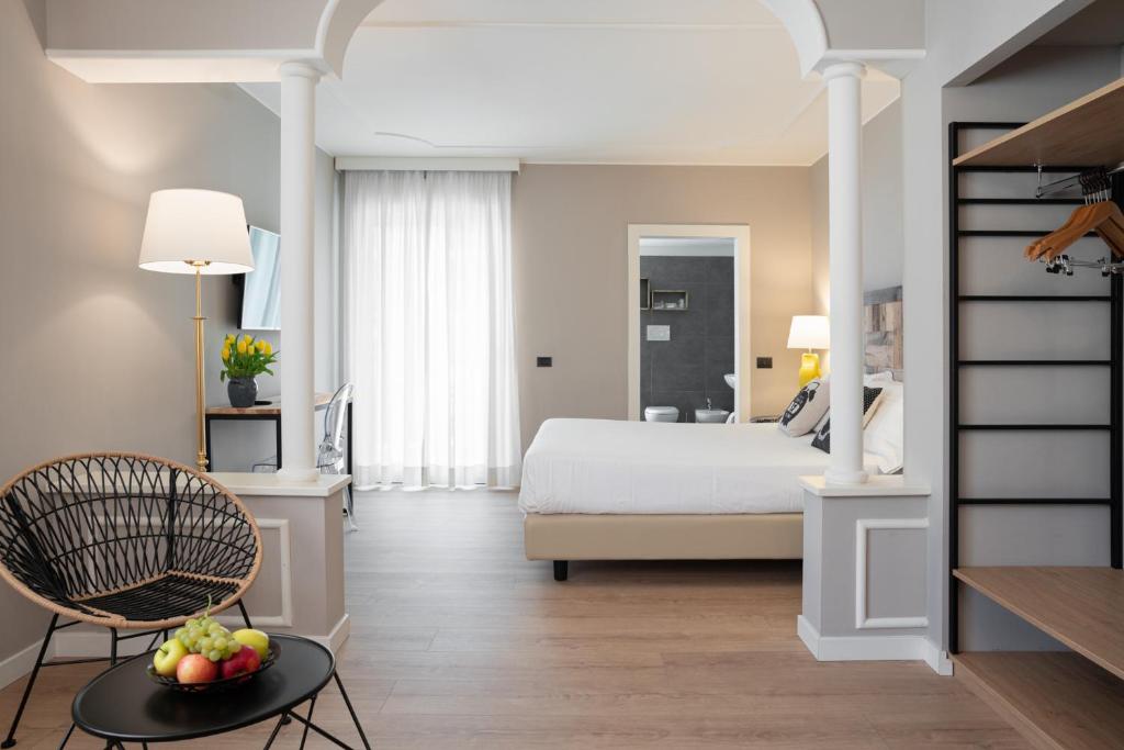 Postel nebo postele na pokoji v ubytování Hotel Leon d'Oro