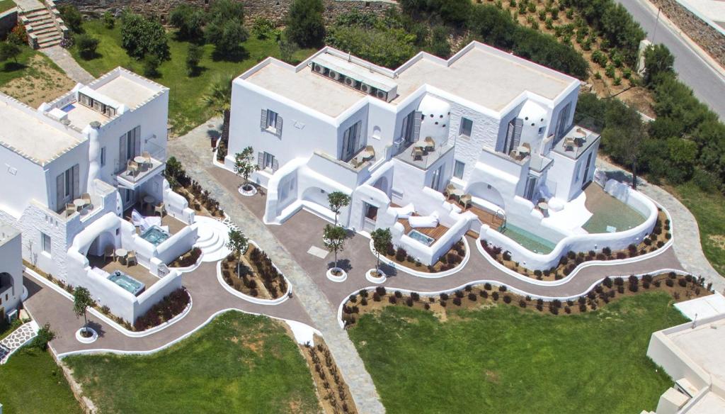 an aerial view of a large white house at Golden Sun Hotel in Stelida
