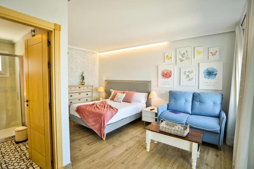 Postel nebo postele na pokoji v ubytování El Patio de los Jazmines Boutique-House