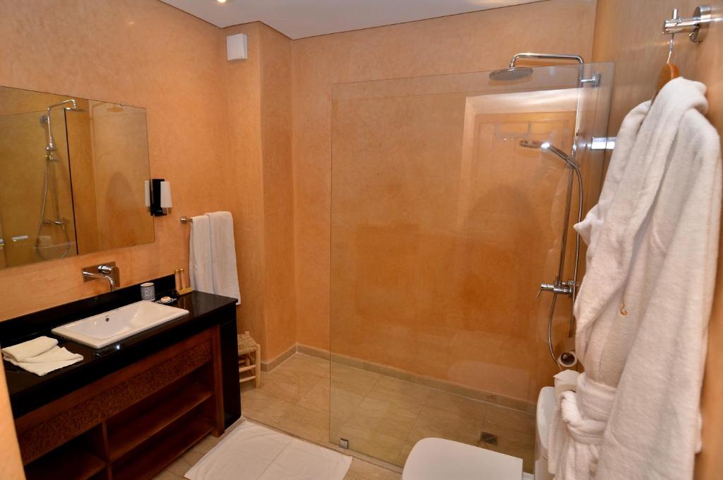 a bathroom with a shower and a sink at Riad Al Ansari in Fez