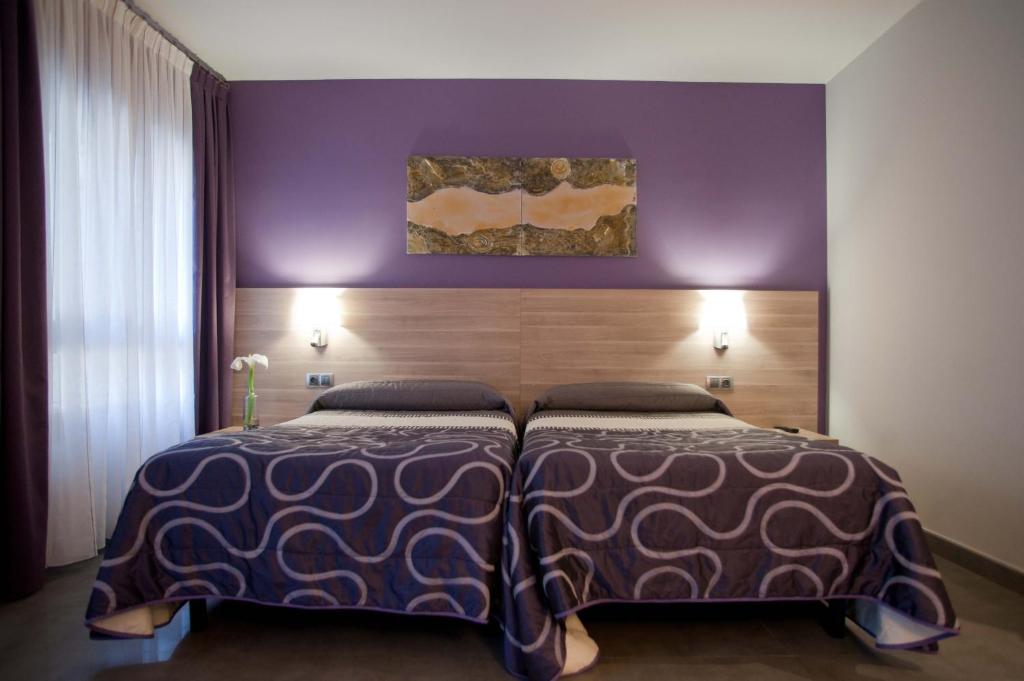 Postel nebo postele na pokoji v ubytování Hotel Victor