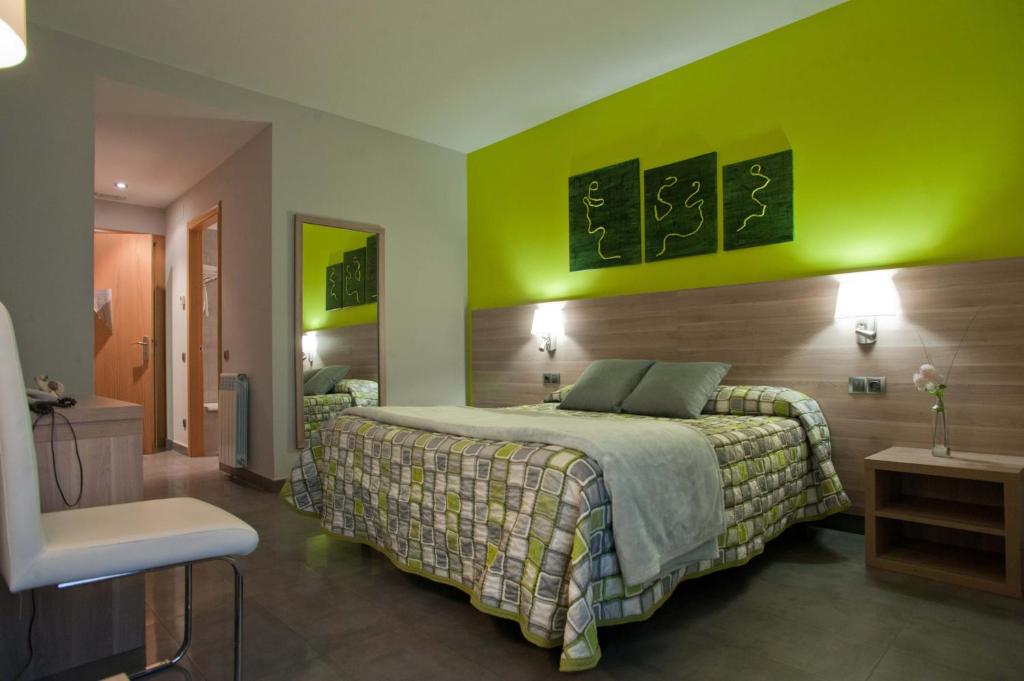 Postel nebo postele na pokoji v ubytování Hotel Victor