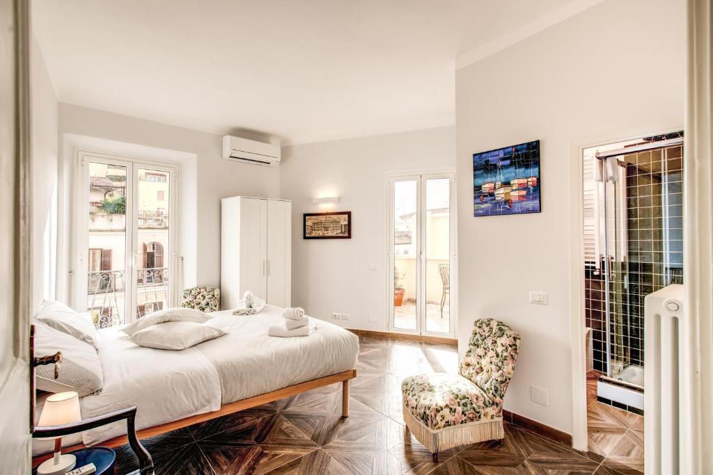 Posteľ alebo postele v izbe v ubytovaní Cavour Attic with terrace