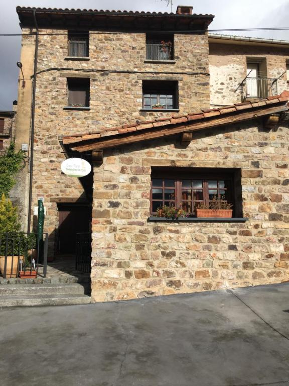 a brick building with a window and a frisbee at Casa Rural Senderismo in Lumbreras