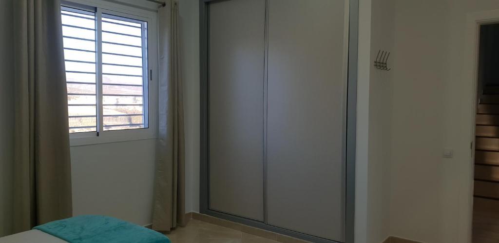 Łóżko lub łóżka w pokoju w obiekcie Villa Rustica Gran Canaria