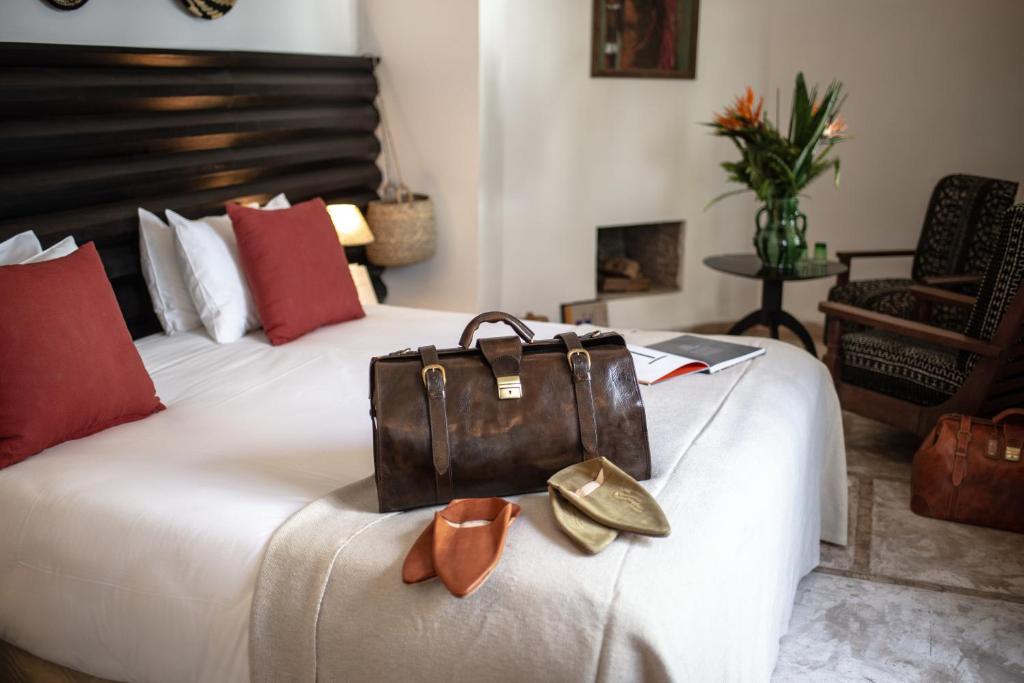 Ein Bett oder Betten in einem Zimmer der Unterkunft Riad Palais Calipau