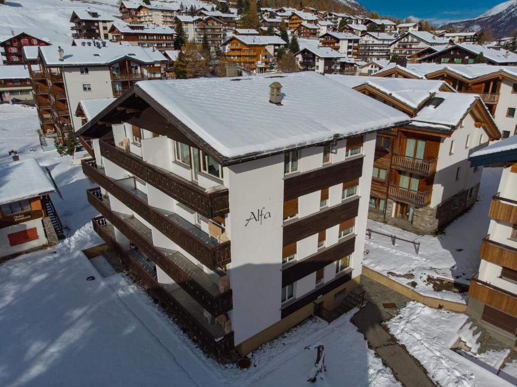 an aerial view of a building in the snow at Haus Alfa in Saas-Fee