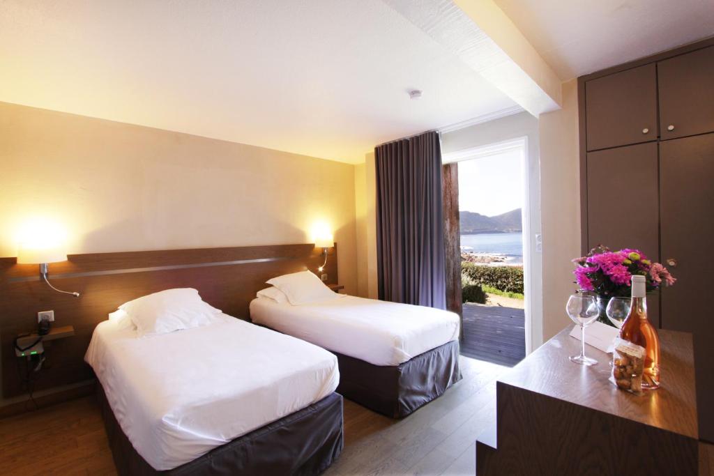 Postel nebo postele na pokoji v ubytování Village de vacances Paese di Lava, Grand Ajaccio