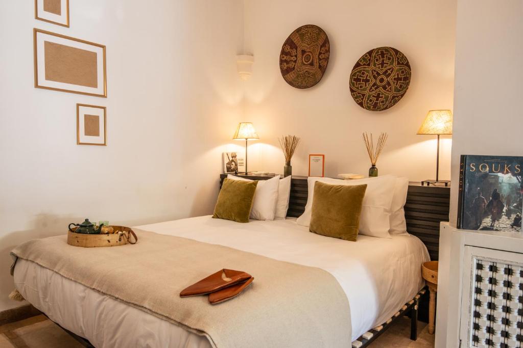 Ein Bett oder Betten in einem Zimmer der Unterkunft Riad Palais Calipau