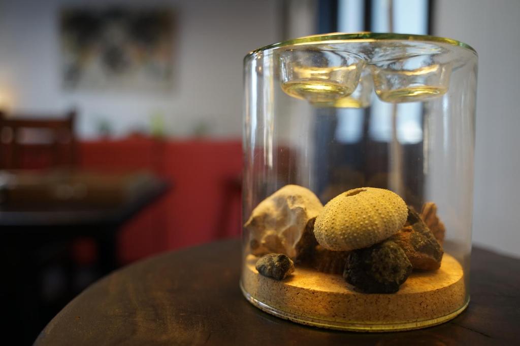 a glass jar filled with mushrooms on a table at B&B La Mimosa in Teguise