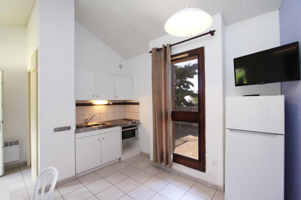 Kuchyň nebo kuchyňský kout v ubytování Village de vacances Paese di Lava, Grand Ajaccio