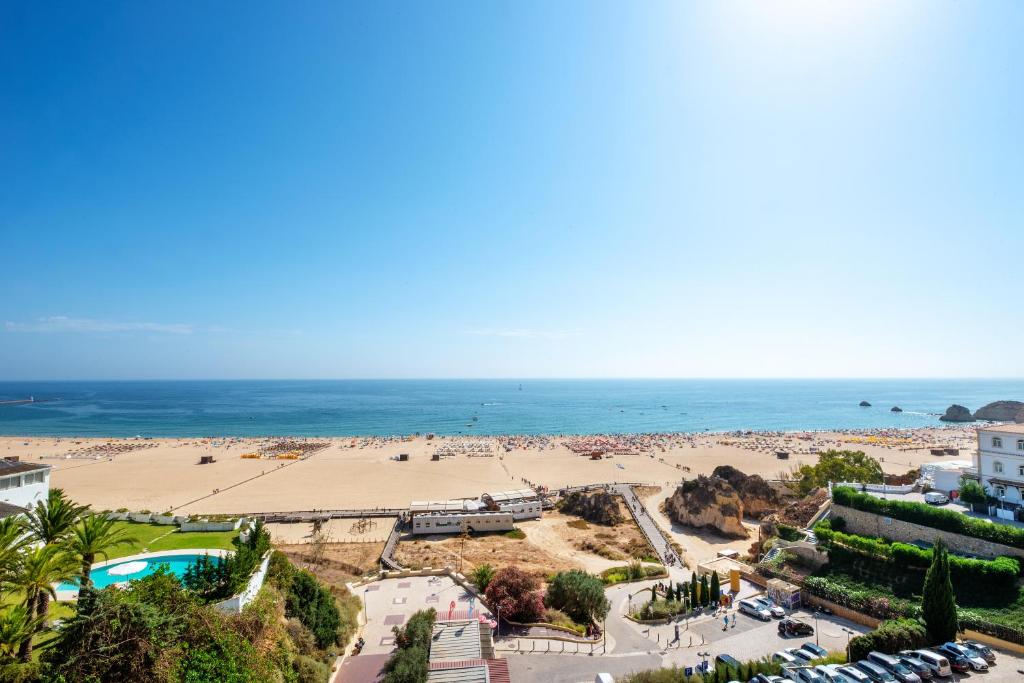 an aerial view of a beach and the ocean at RR Hotel da Rocha in Portimão