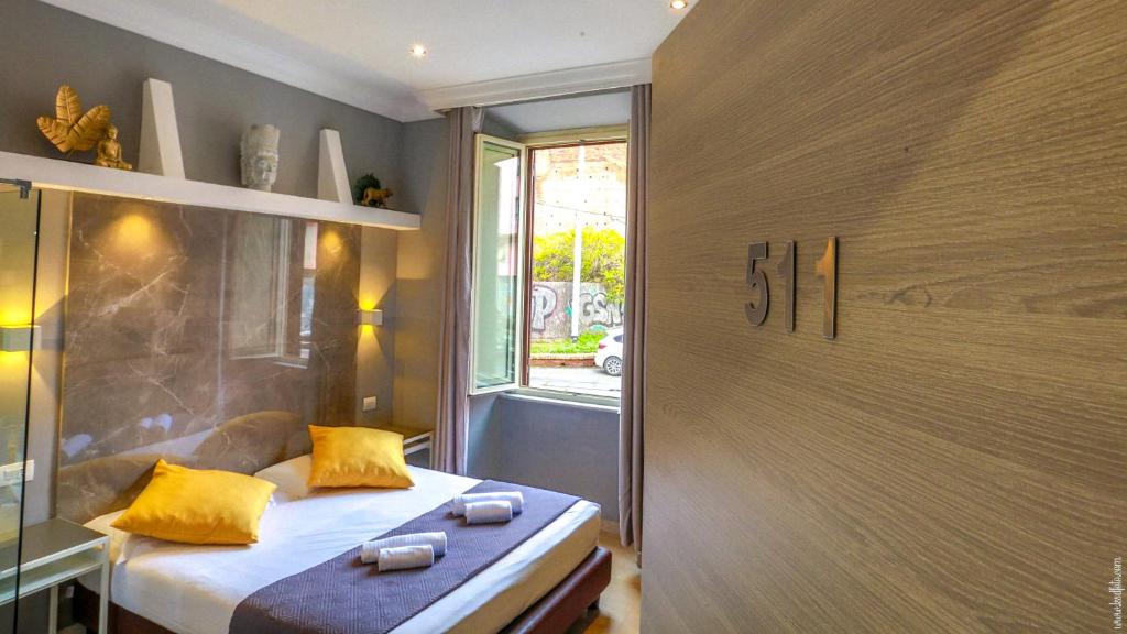 Postel nebo postele na pokoji v ubytování Hotel Giolitti Smart