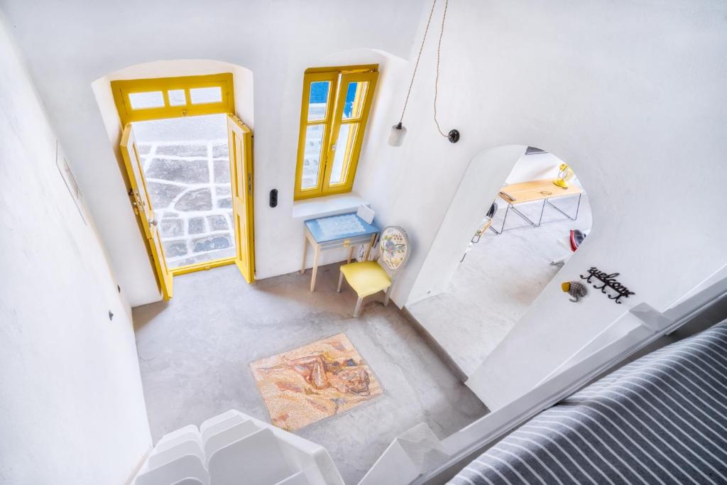 an overhead view of a room with a table and a chair at Serifos 1890 cliff house in Serifos Chora