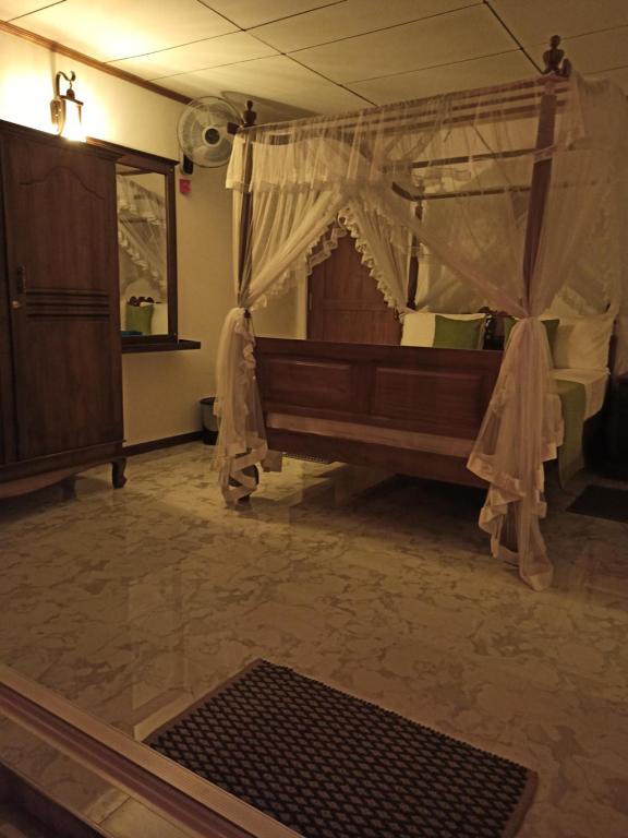 Letto o letti in una camera di Suriya Homestay Mirissa