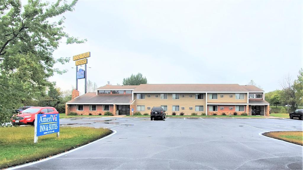a parking lot in front of a large building at AmeriVu Inn & Suites-Avon in Avon