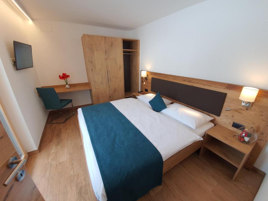 Letto o letti in una camera di Engadin Lodge PREMIUM & PRIVATE