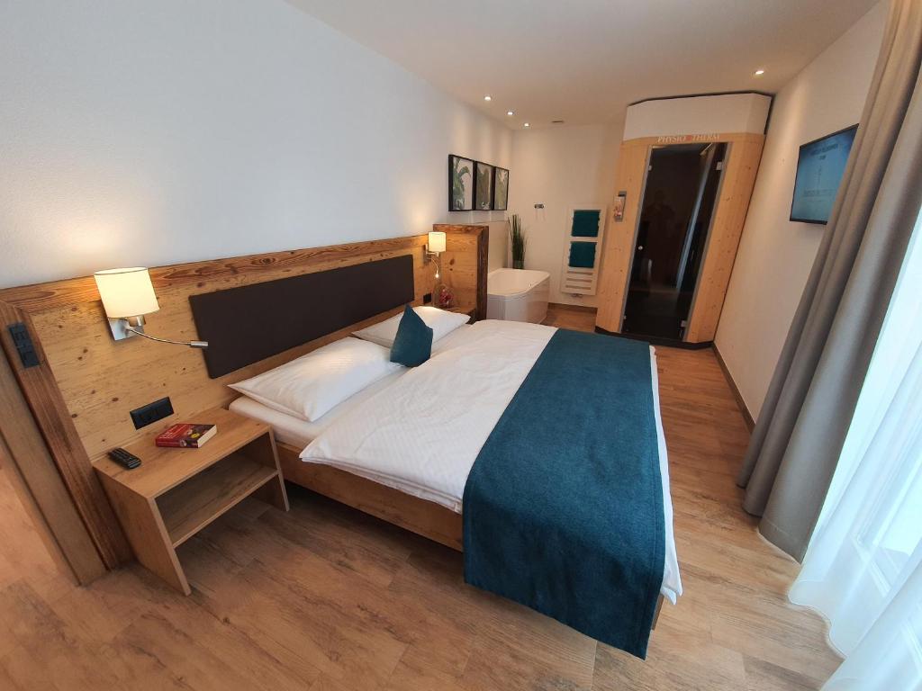Letto o letti in una camera di Engadin Lodge PREMIUM & PRIVATE