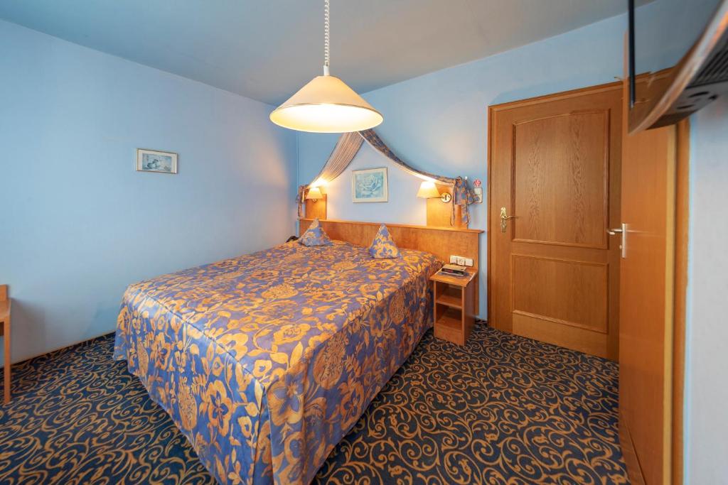 Postel nebo postele na pokoji v ubytování Hotel Höhn