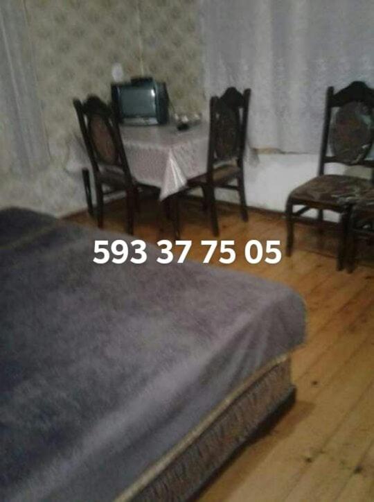 Postel nebo postele na pokoji v ubytování Levani's GuestHouse