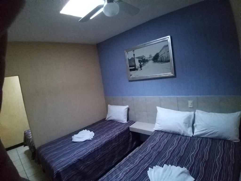 Postel nebo postele na pokoji v ubytování Hotel Aguila