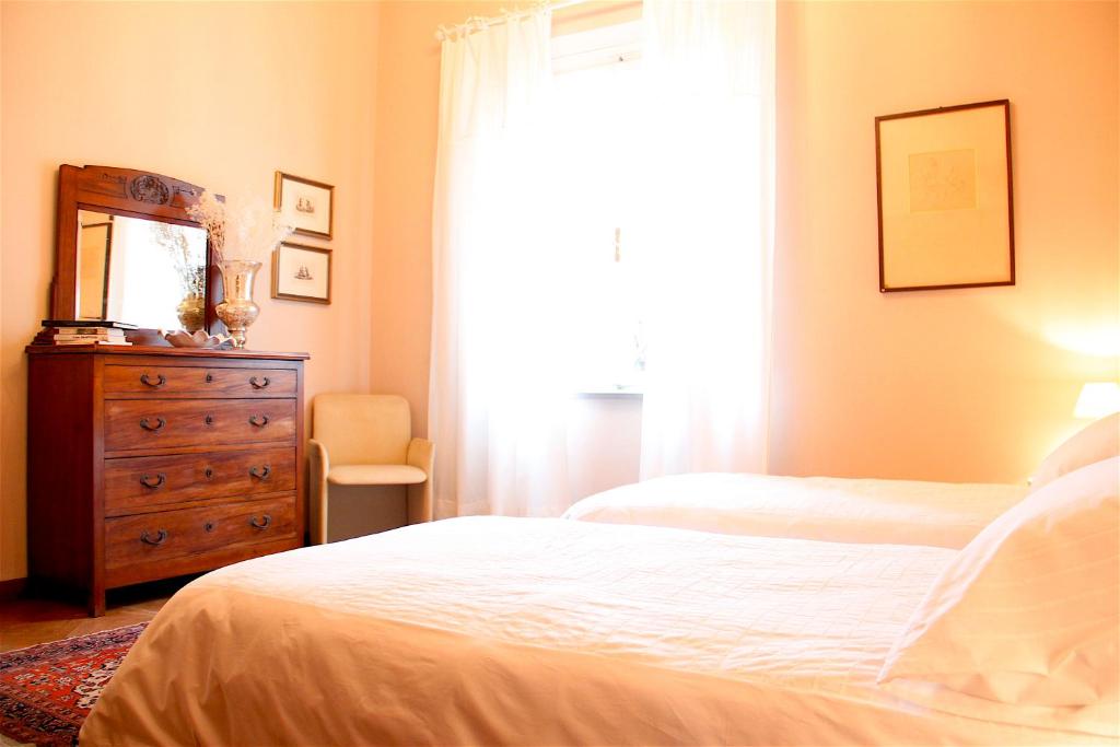 A bed or beds in a room at Art Apartment Villa Mannelli