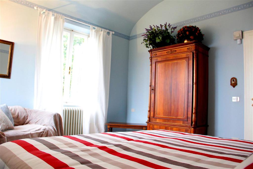 A bed or beds in a room at Art Apartment Villa Mannelli