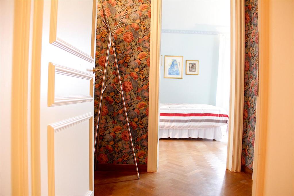 A bed or beds in a room at Art Apartment Villa Mannelli