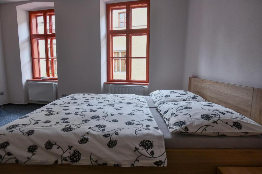Posteľ alebo postele v izbe v ubytovaní Pivovar Prachatice
