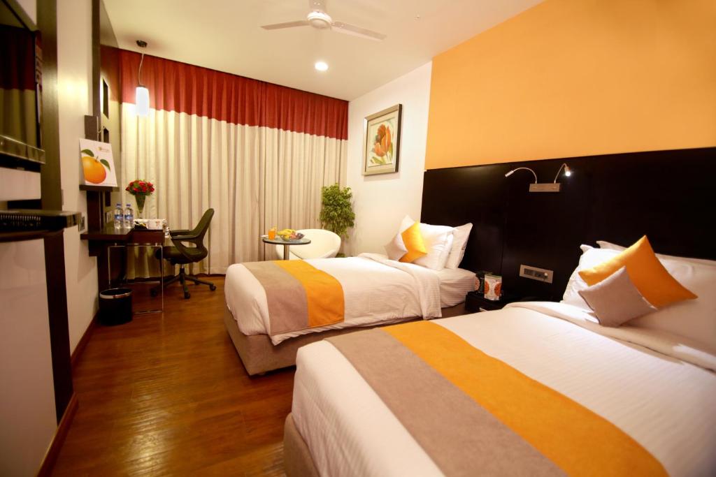 Postel nebo postele na pokoji v ubytování Astoria Hotels Madurai