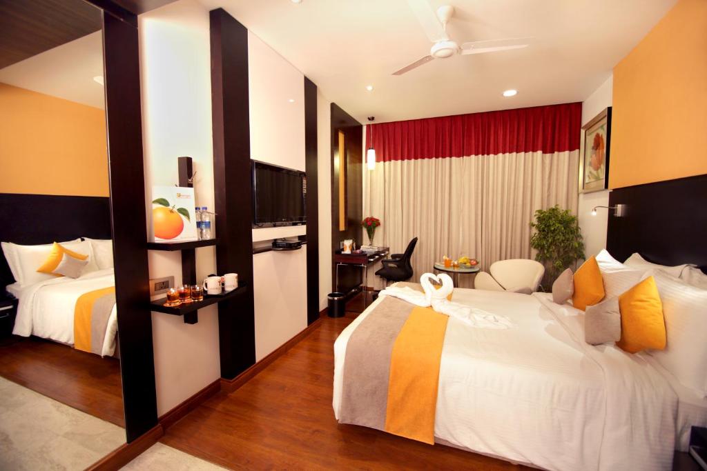 Postel nebo postele na pokoji v ubytování Astoria Hotels Madurai