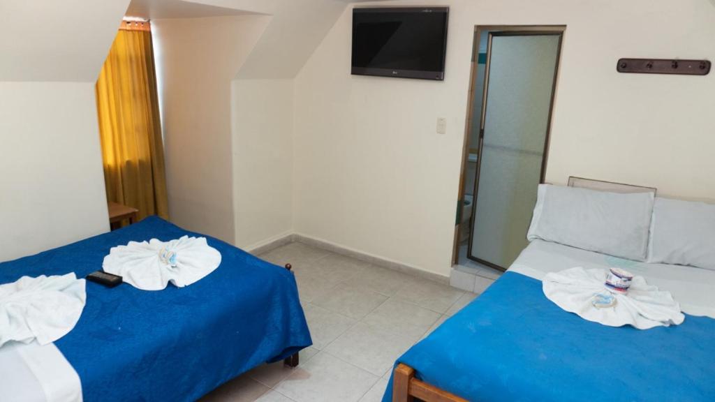 Postel nebo postele na pokoji v ubytování Hospedaje Wicirare