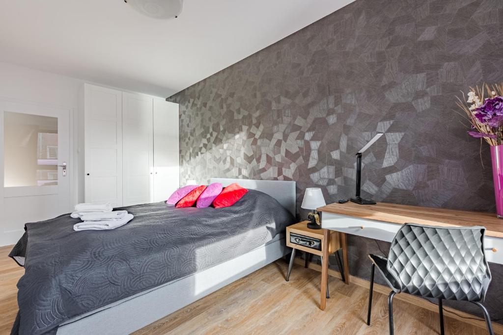 Postel nebo postele na pokoji v ubytování Loft Apartments