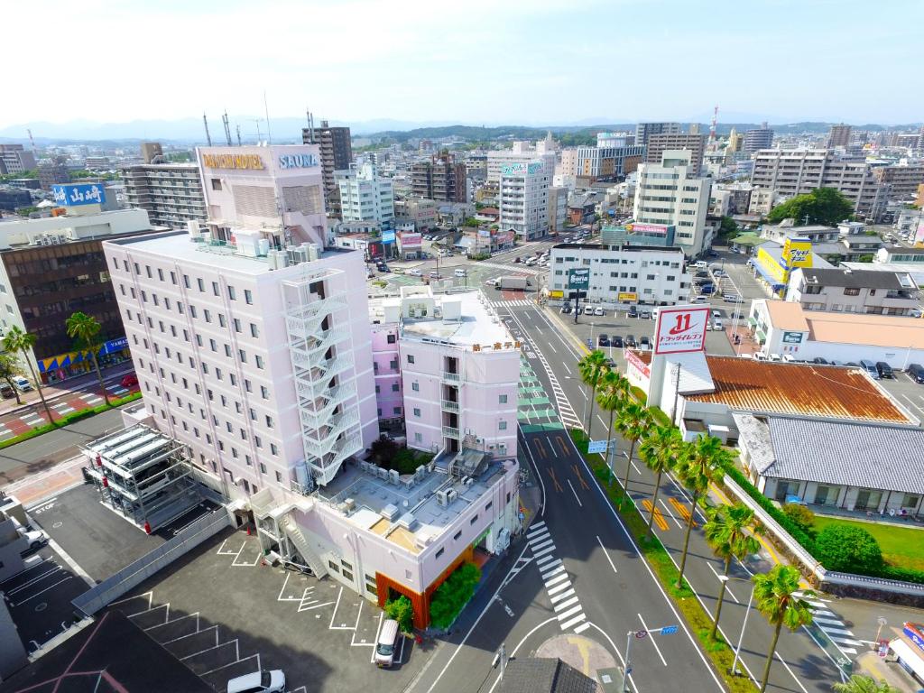 an aerial view of a city with buildings at Miyazaki Daiichi Hotel in Miyazaki