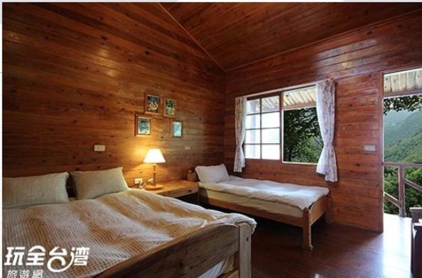 Postel nebo postele na pokoji v ubytování Da Kuan Peach Farm Resort