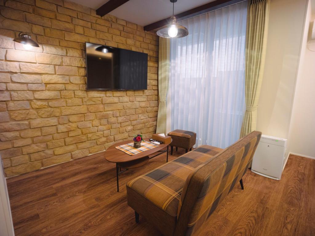 TV a/nebo společenská místnost v ubytování GRAND BASE Hakata Sumiyoshi